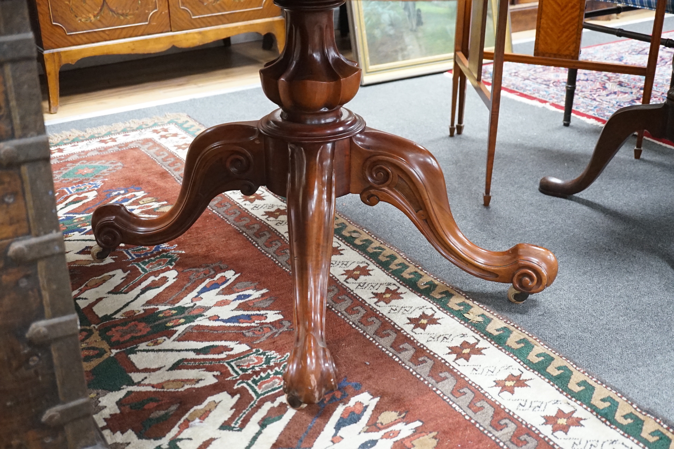 A Victorian figured walnut oval tilt top loo table, width 136cm, depth 102cm, height 74cm